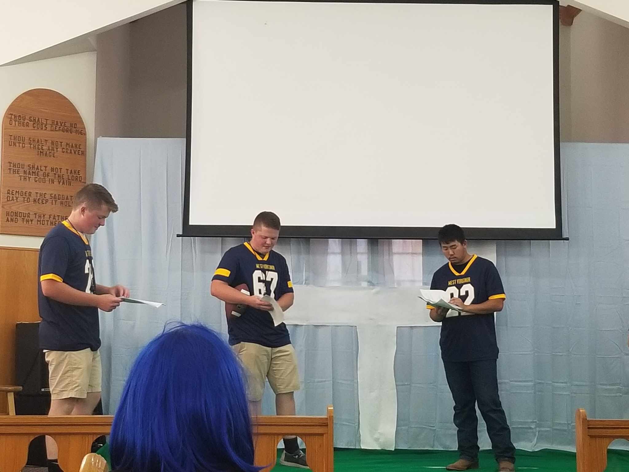 Youth program participants presenting on stage